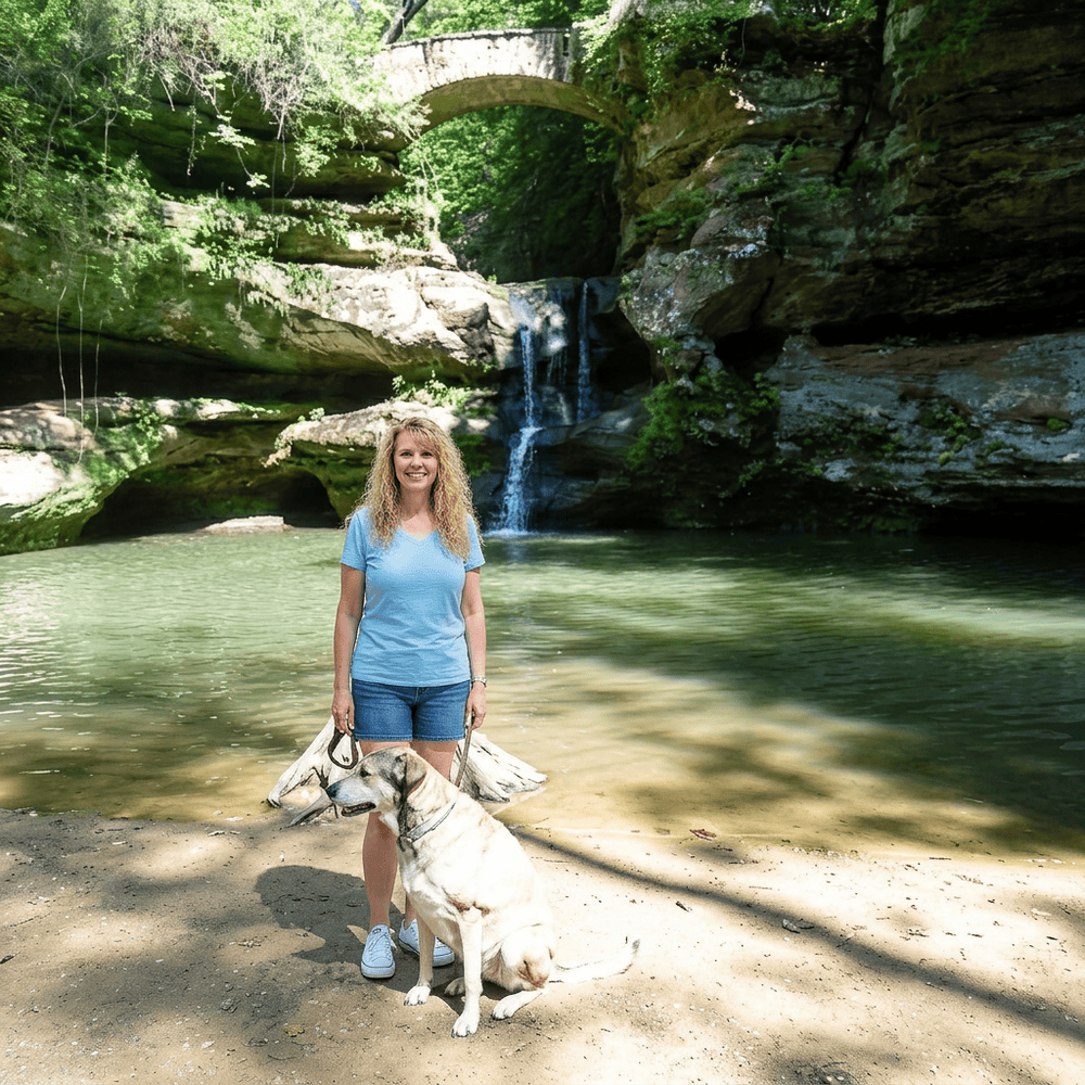 Renee and her dog Lacey at a waterfall
